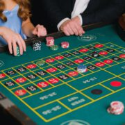 a person holding casino chips