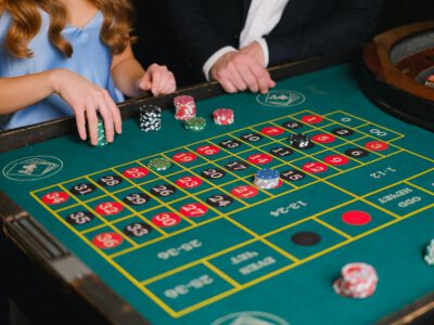 a person holding casino chips