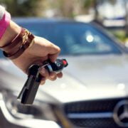 close up of woman closing the car from a distance