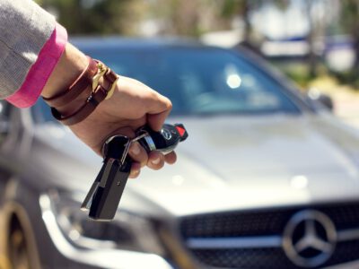 close up of woman closing the car from a distance