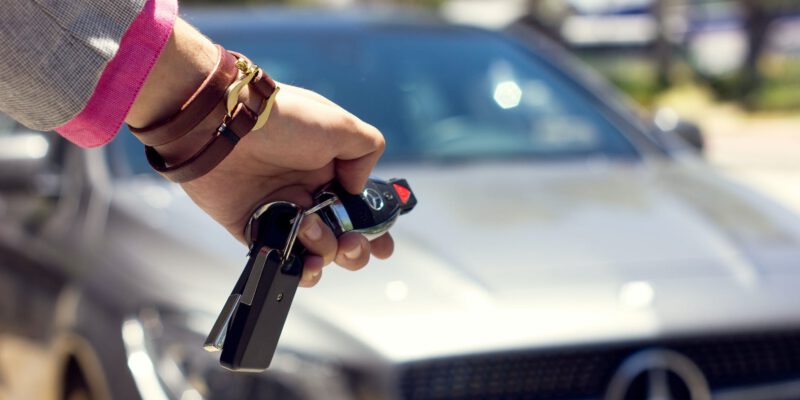 close up of woman closing the car from a distance