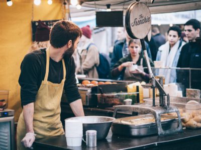 man standing in front of bowl and looking towards left